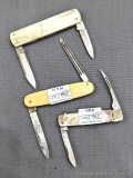 Three vintage folding pocket knives with mother of pearl, and other handles. All three knives are in
