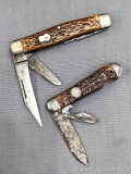 Two vintage Remington folding pocket knives with chipped bone or stag handle slabs. Both knives are
