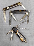 Three vintage folding pocket knives marked Sheffield England, and others. Larges knife measures 2