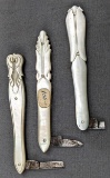 Three vintage folding pocket knives with mother of pearl handles. The knives are missing most of the