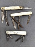 Three vintage folding pocket knives with mother of pearl handles. The knives are in pretty good