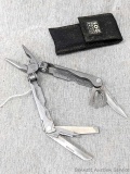 SOG USA Paratool multitool knife with sheath. Features pliers, saw and knife blades, much more. Also