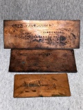 Three copper plates remind me of old newspaper presses but different as they read forwards. In a