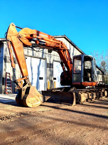 Watch the video. Hitachi model EX135UR excavator with side-swing boom, two buckets, thumb.