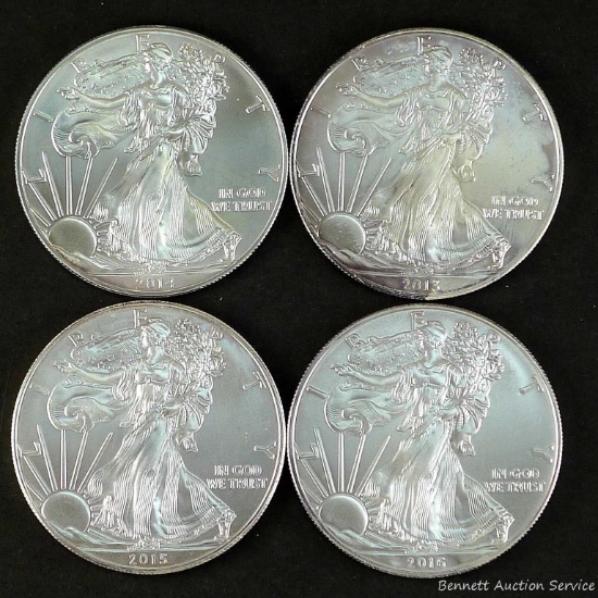 Four American Silver Eagles.