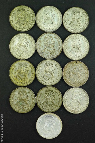 Mexican silver pesos dated 1957, 1958, 1959, 1961 and 1967.