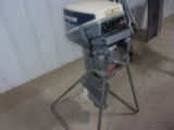 15 H.P. EVINRUDE OUT BOARD ON STAND