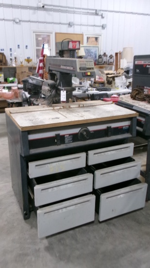 10" CRAFTSMAN 2 3/4 H.P. RADIAL ARM SAW ON TOOL BENCH