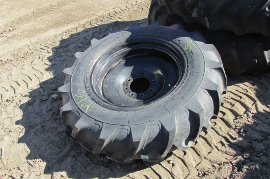 12.4 X 24" LUG TIRE ON 8 BOLT RIM