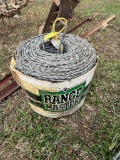Roll of Barb Wire and T-Posts
