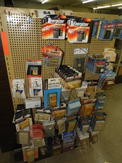 Display rack of assorted batteries, plate covers