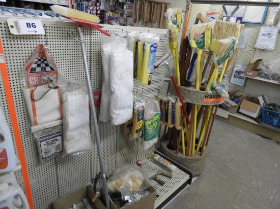 Rack of mop supplies, head, handles, squeegees