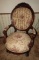 Wooden armchair w/ upholstery, carved rose accents