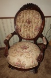 Wooden armchair w/ upholstery, carved rose accents