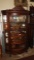 Nice oak curved glass china cabinet w/ lion accent