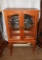 Modern curio cabinet w/ legs, glass doors & sides