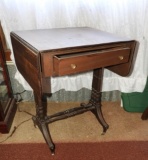 Double drop leaf wooden accent table on casters