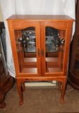 Modern curio cabinet w/ legs, glass doors & sides