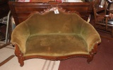 Upholstered loveseat w/ exposed wood accents, 32