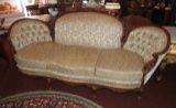 Upholstered couch w/ carved wood accents, 37