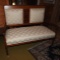 Oak settee w/ beaded trim, newer upholstery