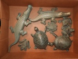 Group of cast decorator pieces including turtles,