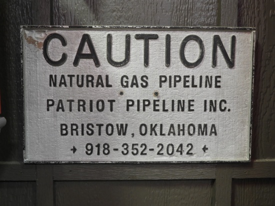 Cast Patriot Pipeline Caution sign, 20"x12"