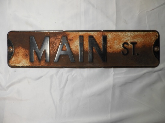Stamped steel street sign "Main St." 24"x6"