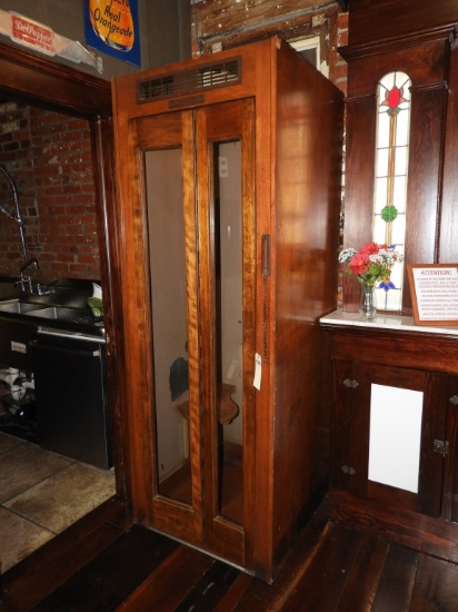Wooden phone booth w/ phone, metal lined