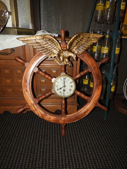 Ships wheel clock marked Bisn Company, 28"x27"