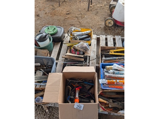 Row of Tools Including Grease Guns, Measuring Tapes, Etc.