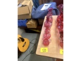 Row of Cranberry Glass