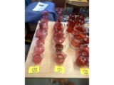 Row of Cranberry Glass