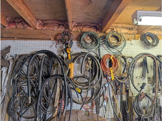 Assorted Items On East Wall Including Hydraulic Hoses, Chainsaw Chains & Bars, Belts, Etc.