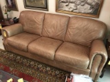 BROWN LEATHER SOFA WITH TACKED ARMS - 87''