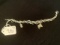 .925 STERLING SILVER BRACELET WITH CHARMS - 27G