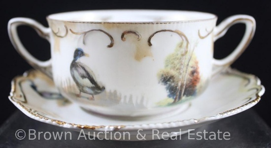 R.S. Prussia Mold 304 dbl. handled cup and saucer, Black duck and trees on white with gold
