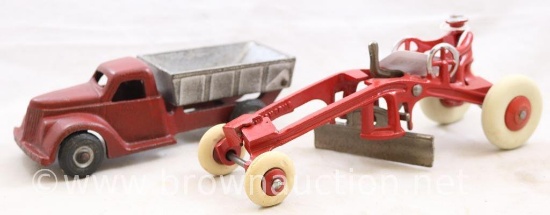 (2) Cast Iron toys: mrkd. Arcade 6.5"l dump truck; mrkd. Kenton 8"l road grader