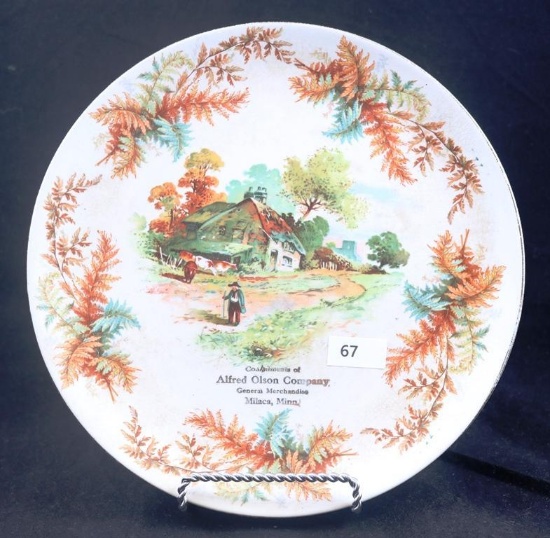 Scenic advertising plate, "Compliments of Alfred Olson Co. General Merchandise, Milaca, Minn",