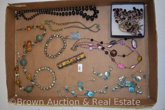 Box of assorted costume jewelry incl. necklaces and bracelets