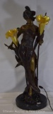 Figural bronze lamp of maiden holding 2 illuminating flowers with translucent shades, 27