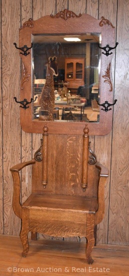 Oak hall tree with lift-lid seat, large beveled mirror, 4 coat/hat hooks, carved applications, 6'10"