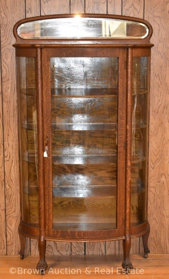 China cabinet with curved glass sides and paw feet, backsplash with beveled mirror, 5 wood shelves,