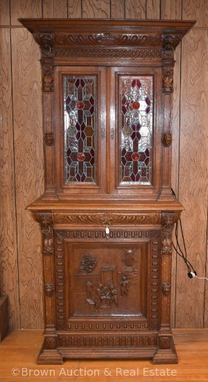 Very ornately large cabinet, possibly a liquor cabinet/bar piece, double leaded glass doors at top