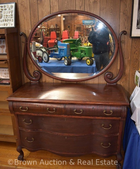 Dresser with top roller drawers and 2 serpentine lower drawers, large oval beveled swing mirror