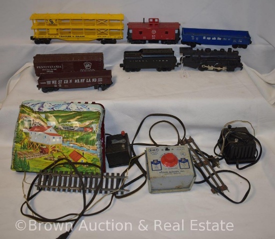 Assortment of train cars, tracks and transformers