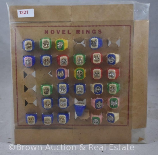 Assortment of (29) plastic Novel rings on cardboard display