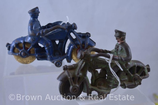 (2) Cast Iron Police motorcycles with riders: 1-green "Champion"; 1-blue