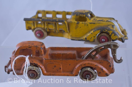 (2) Cast Iron 5.5" trucks: 1-Hubley #2332 wrecker tow truck; 1-gold stake truck