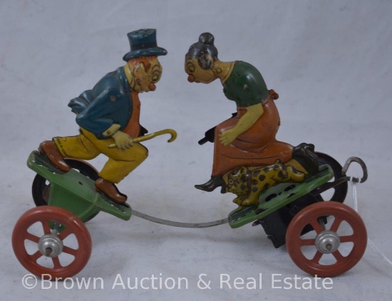 Mrkd. Made in Germany tin wind-up toy, fighting husband (armed with cane) and wife (armed with